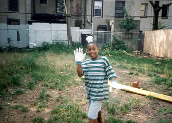 young garden helper shows work gloves