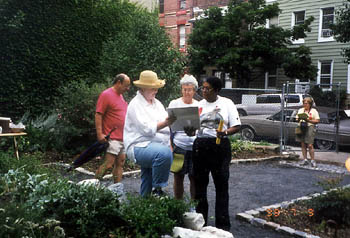 judges reviewing garden history book